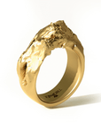 Cascades Ring in 20k Gold by Tropaêz, featuring bold peaks and plunges, 9mm wide--side angle view.