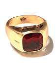 Grand Touring Ring in 20k Yellow Gold by Tropaêz, featuring a deep red garnet and resort styling.