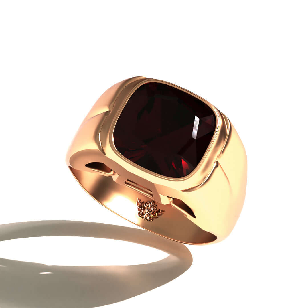 Grand Touring Ring in 20k Yellow Gold by Tropaêz, featuring a deep red garnet and resort styling--view of the stone from above.