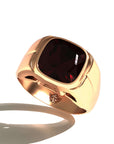 Grand Touring Ring in 20k Yellow Gold by Tropaêz, featuring a deep red garnet and resort styling--view of the stone from above.